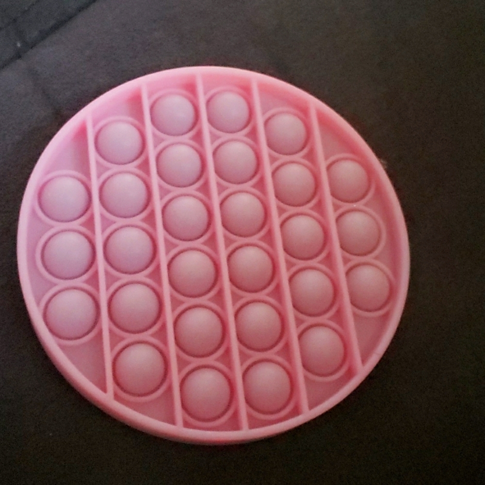 Light pink glow in the dark poppit